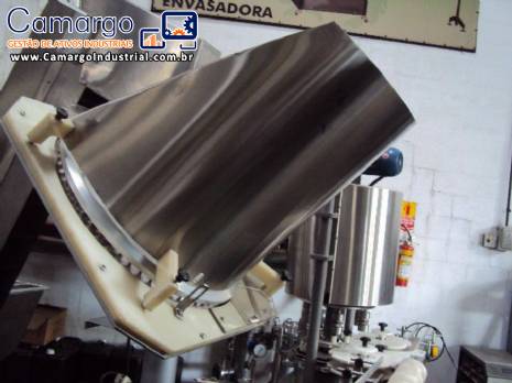 Alimentador e posicionador de tampas rotativo autom�tico